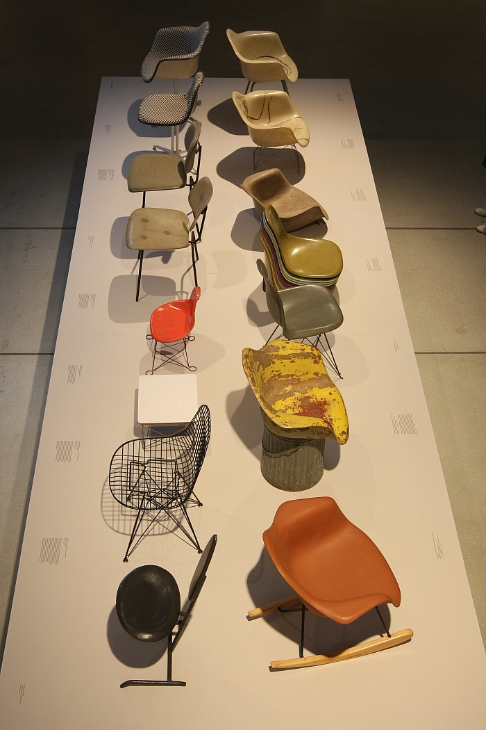 A collection of stamped metal, moulded fibreglass and wire seat shells, as seen at The World of Charles and Ray Eames, Barbican Art Gallery London (21.10.2015 - 13.02.2016)