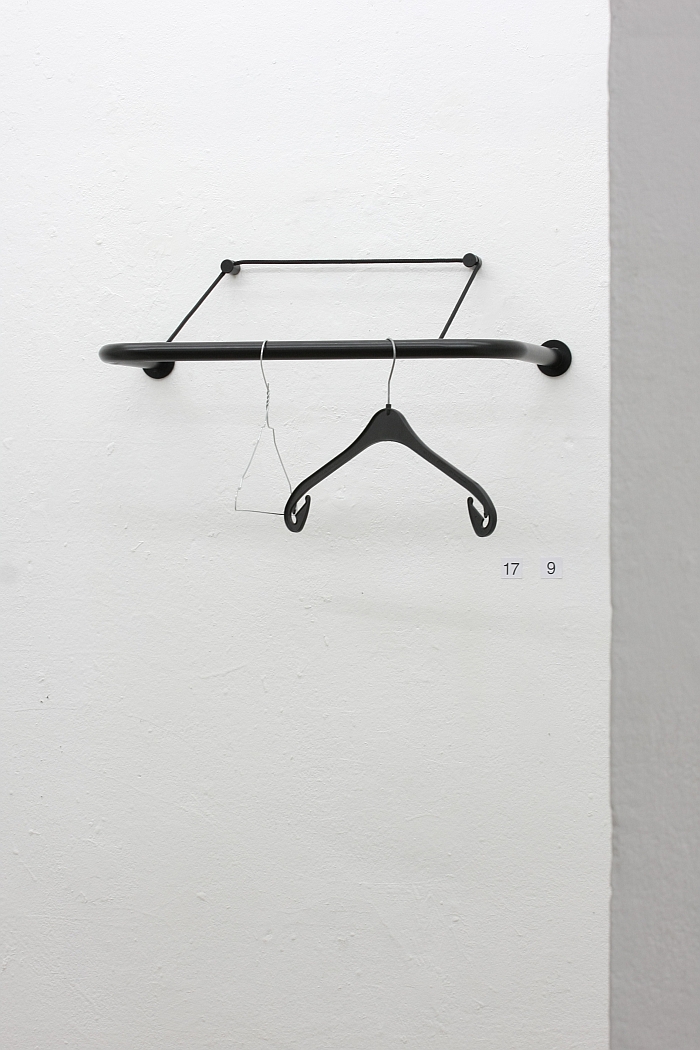 A black plastic and ametal coat hook - presented on the Gravity coat rack, as seen at Thomas Schnur - 21 Common Things