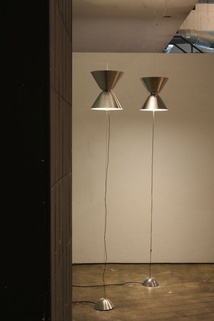 Aureole by Daniel Becker. Shines both upwards and downwards, moving the bod up and down the wire adjust the intensity