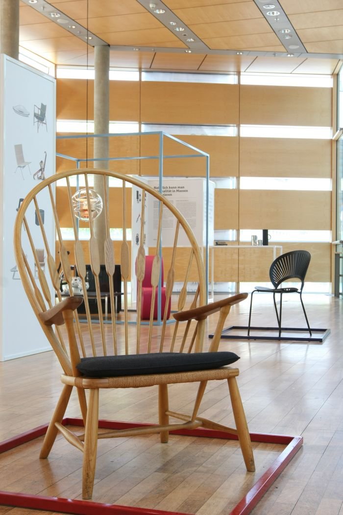 Peacock by Hans J. Wegner (foreground), Trinidad Chair by Nanna Ditzel (background), as seen at Much More Than One Good Chair, Felleshus Berlin