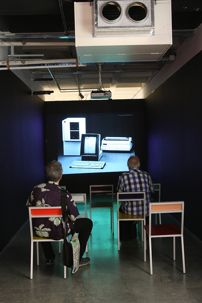 Viewing archive images of Brussels Design Centre, in the comfort of Müller van Severen chairs, as seen at Panorama. A History of Modern Design in Belgium, ADAM Brussels 