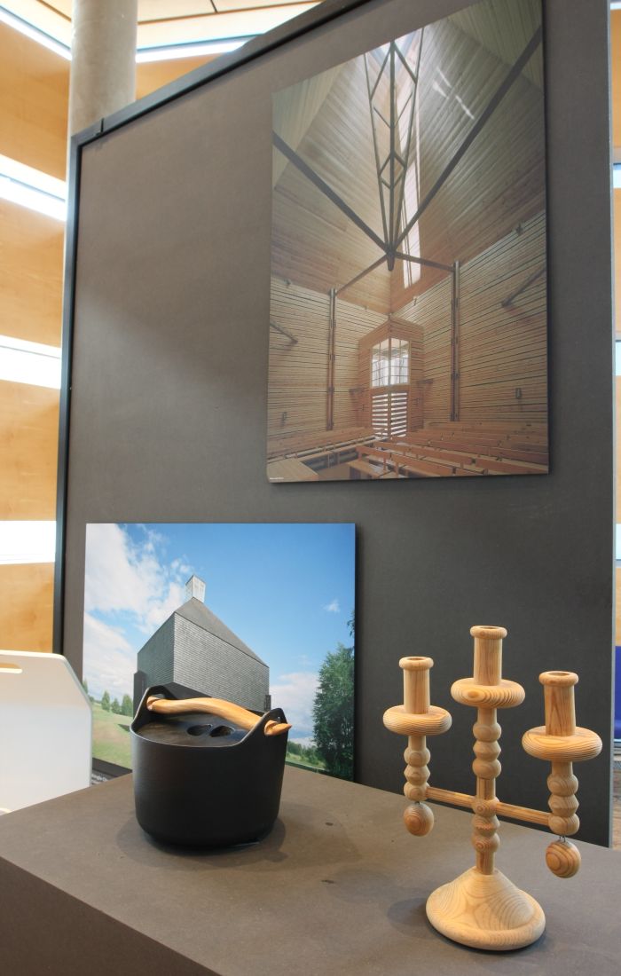 Wooden candle holder by Nanny Still & Cast iron casserole by Timo Sarpaneva and Shingle Church in Kärsämäki by Anssi Lassila, as seen at Echoes - 100 Years in Finnish Design and Architecture, Felleshus, The Nordic Embassies, Berlin