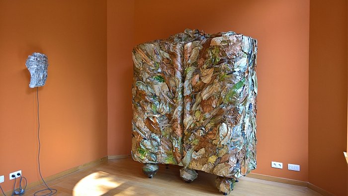 A cupboard crafted from exotic leaves, as seen at Marcin Rusak - Nature of Things II at the Horta Museum, Brussels