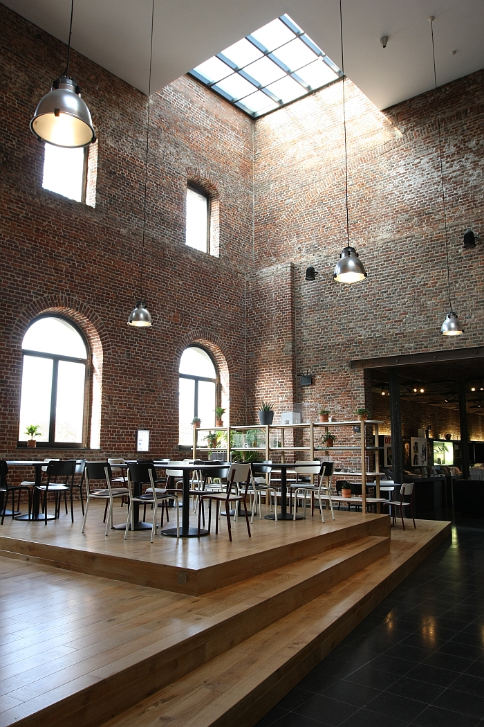 The new cafeteria area as designed by Benoît Deneufbourg for CID - centre d'innovation et de design au Grand-Hornu, the split level floor is made from locally salvaged wood.