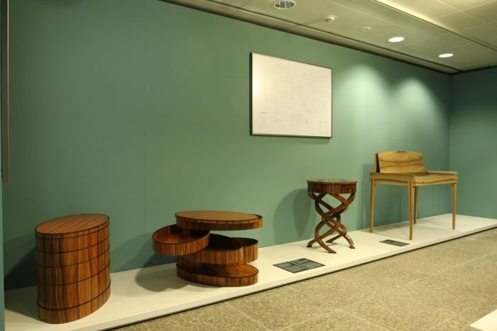 Chest of drawers by students at Berufsschule für Holzschnitzerei und Schreinerei in Berchtesgadener,games table by André Kotik, and desk by Christian Mathis