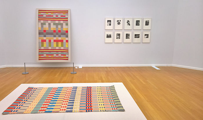 Piano cover by Gertrud Arndt & photos by Marianne Brandt (rear), Children's carpet by Otti Berger (foreground), as seen at Bauhaus. Textiles and Graphics, Kunstsammlungen Chemnitz