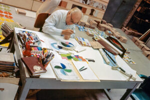 Gio Ponti designing ceramic floor tiles at the Ceramica D’Agostino factory in Salerno, 1964 (Photo © Gio Ponti Archives/Historical Archive of Ponti’s Heirs, courtesy Taschen Verlag)