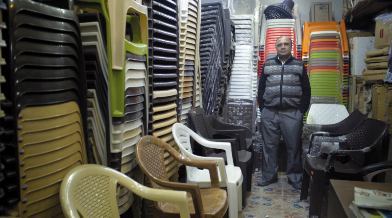 Since 1985 this man's family have sold monoblocs in New Delhi, India. (Photo © Boris Mahlau / PIER 53, courtesy Hatje Cantz)