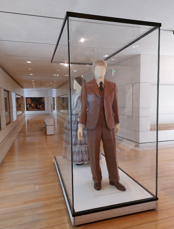 A 1950s herringbone twill suit, as seen in Scotland Transformed, National Museum of Scotland, Edinburgh (The tie is variously coloured, but we wouldn't say multi-coloured, but looks relatively thick, although it is hard to be certain....)