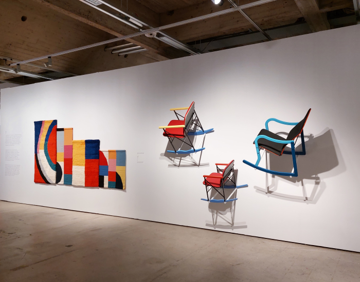 The A-509 rocking chair by Yrjö Kukkapuro, and the rug Leikki by Kristiina Nyrhinen, as seen at Yrjö Kukkapuro - Magic Room, Espoo Museum of Modern Art, EMMA