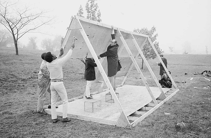 Architect John Wiebenson and helpers construct one of the A-frame houses developed for the 1968 Resurrection City protest camp in Washington D.C., part of Protest/Architecture. Barricades, Camps, Superglue, Deutsches Architekturmuseum, Frankfurt