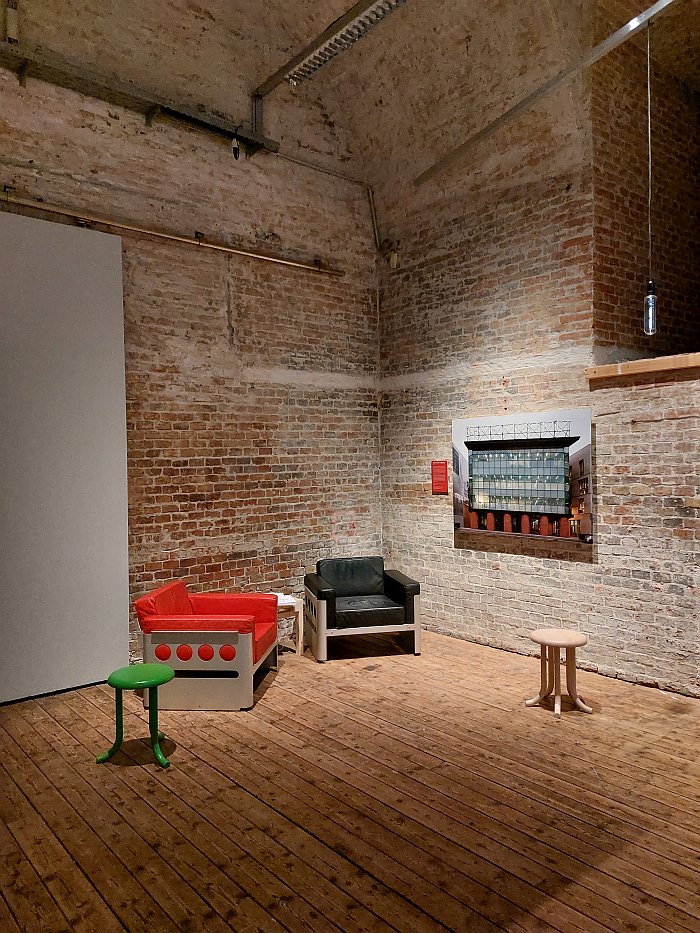 A reading corner featuring chairs by artist Walter Pichler, a close collaborator of and with Hans Hollein, as seen at Hollein Calling. Architectural Dialogues, Architekturzentrum Wien