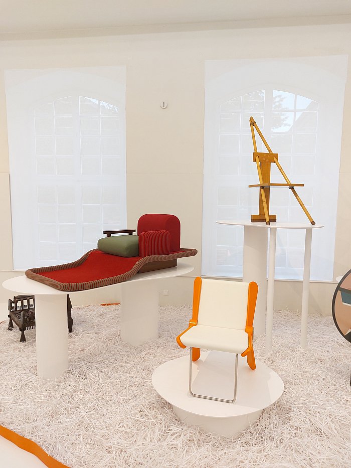 Tappeto Volante by Ettore Sottsass (back left) amongst other works, as see at A Chair and You, Grassi Museum für Angewandte Kunst, Leipzig