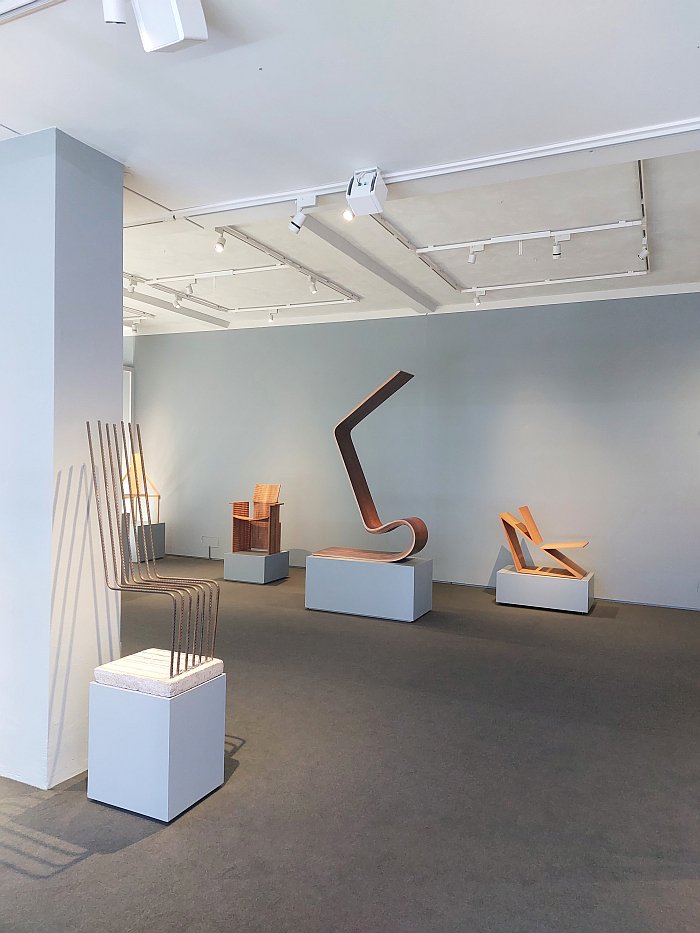 Solid by Heinz Landes (front left) amongst other works, as see at A Chair and You, Grassi Museum für Angewandte Kunst, Leipzig