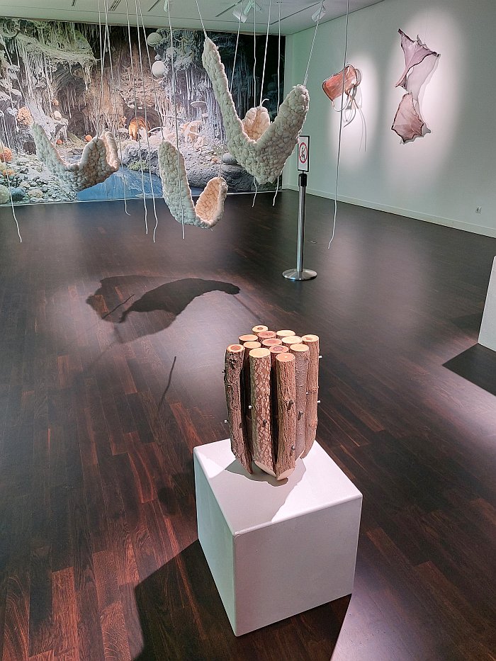 The wooden stool Ordina by Blanka Timári and the Way In To hanging wool chairs by Dóra Riederauer, as seen at Innenraum, Collegium Hungaricum Berlin